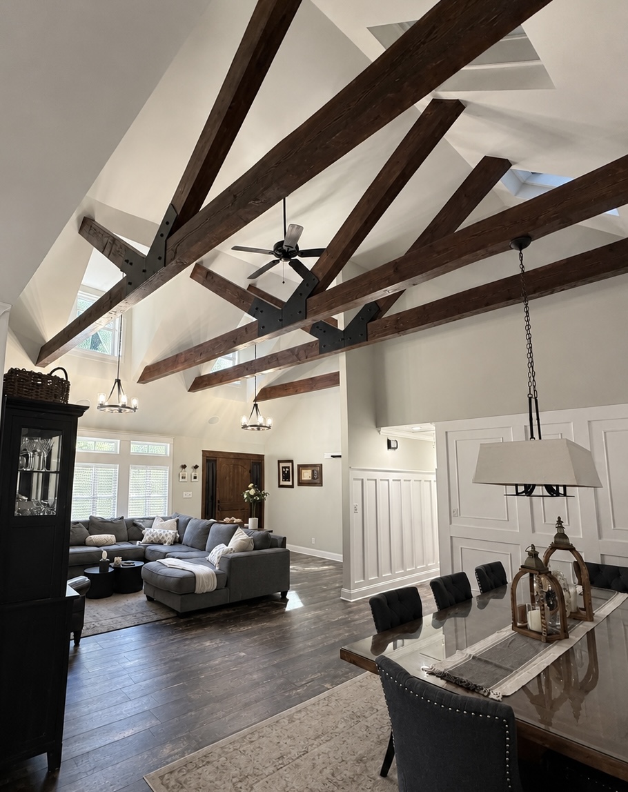 Great room with vaulted ceiling and exposed wood trusses