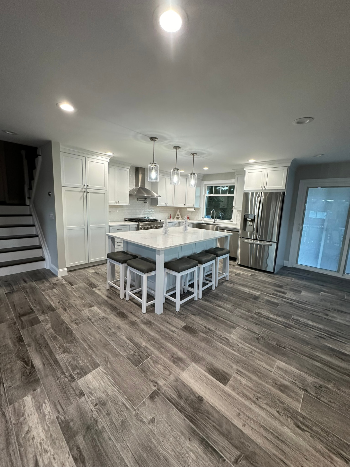 Open-concept kitchen with center island and pendant lighting