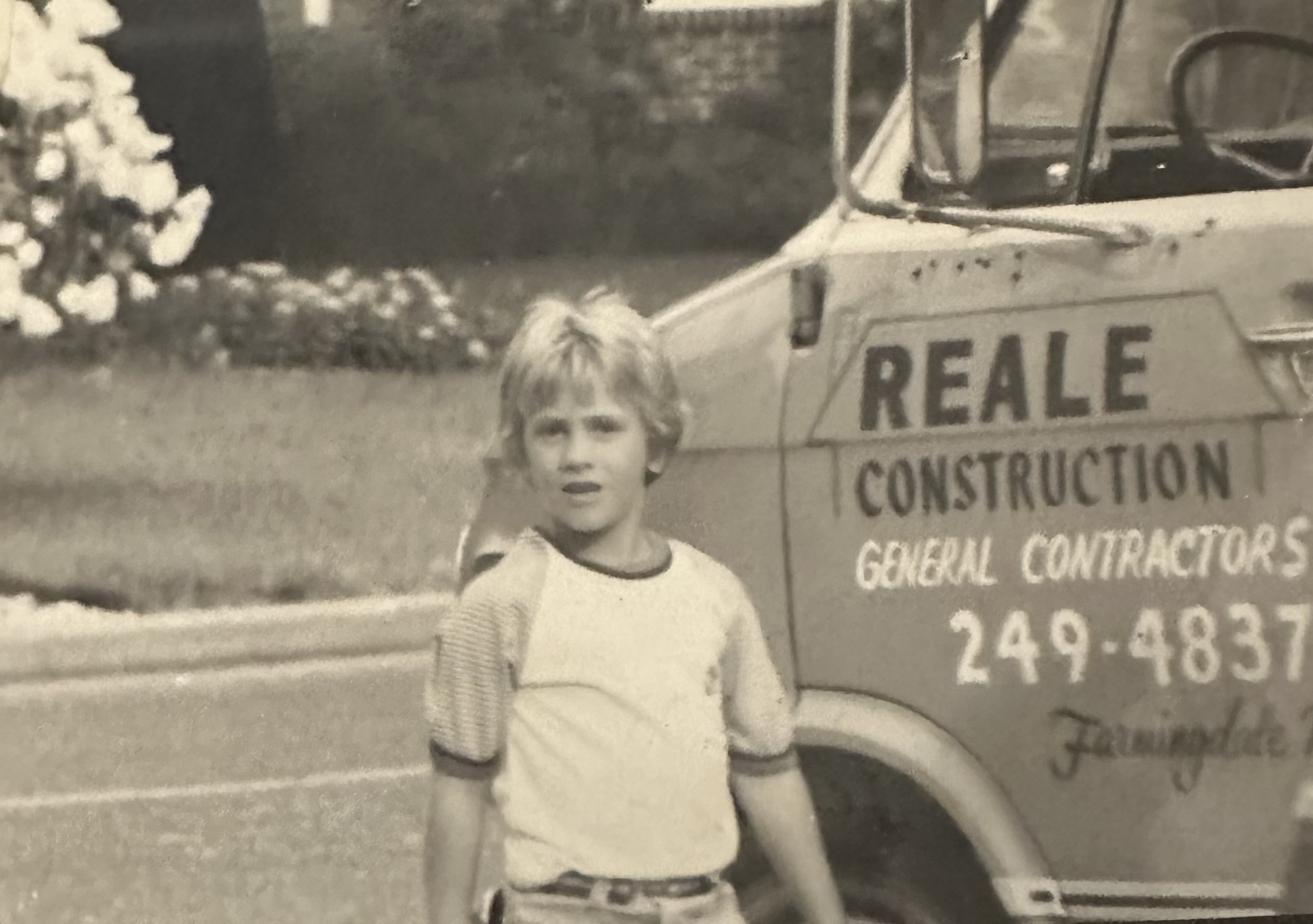 Vintage family photo with an original Reale & Sons Construction truck