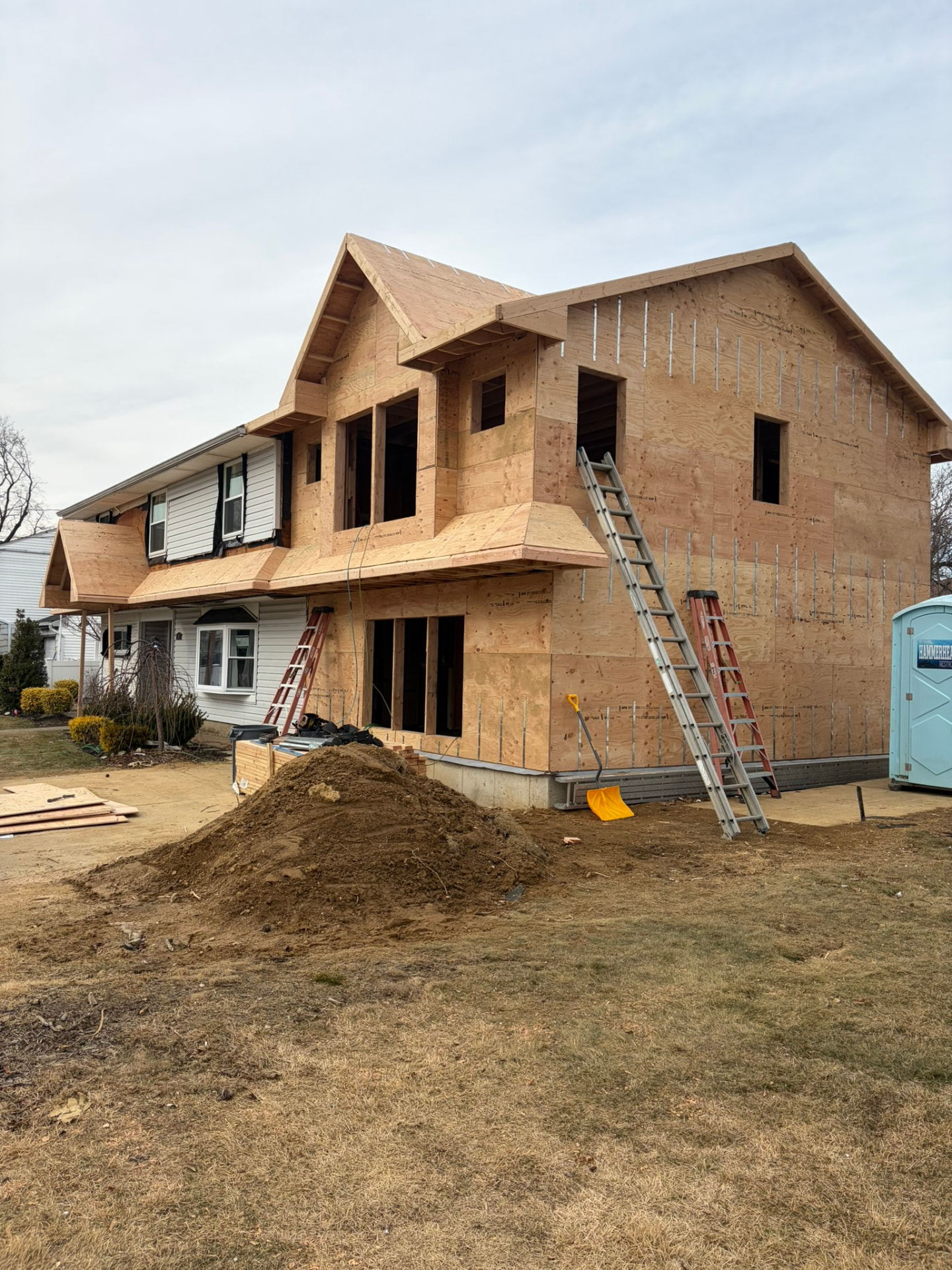 Second-story dormer addition framed and sheathed